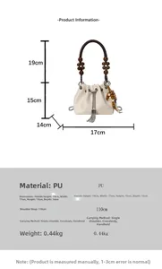 Detailed view of cream PU bucket bag with beaded handle and size dimensions shown