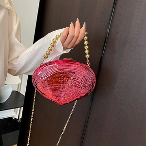 Fuchsia acrylic shell clutch bag with gold bead handle and detachable metal chain