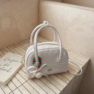 Chic beige bow-knot crossbody bag with holiday bead charm and dual handles