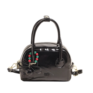 Glossy black Boston bag with beaded pendant and adjustable strap for women