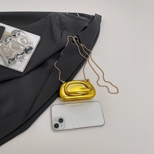 Glossy gold acrylic mini chain bag for women with metallic mirror finish for evening use