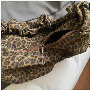 Leopard print tote bag with drawstring shoulder strap and zipper closure in retro style
