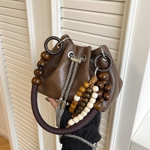 Retro PU leather bucket bag with wooden beads handle and long beaded tassel fringe