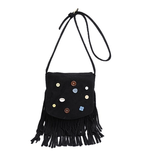 Detail of bohemian black suede bag with colorful buttons, shell, and long fringe