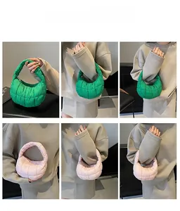 Quilted pleated cloud bag detail showing green and pink colors on models in grid view