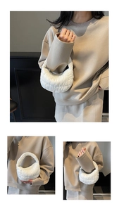Detailed macro view of a white quilted puff handbag with soft cloud-like texture