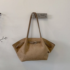 Vintage caramel suede tote bag with decorative buckle strap for autumn commute