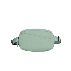 Detail of light green casual waist bag with durable fabric and adjustable black buckle