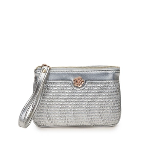 Detailed view of silver woven texture purse with a rose gold floral accent and wrist strap