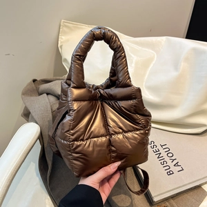 Quilted puffer handbag in metallic copper brown with square padding and top handle