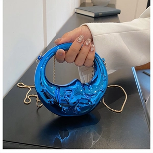 Blue metallic round mini handbag with elephant relief and golden chain strap for evening wear