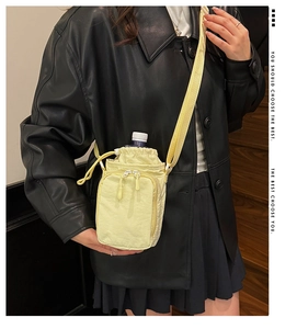 Crossbody nylon water bottle bag with drawstring and front zipper pocket for running