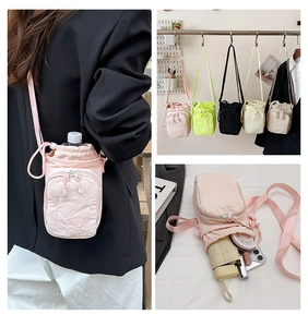 Detailed view of crossbody water bottle bag showing spacious interior for phone and umbrella