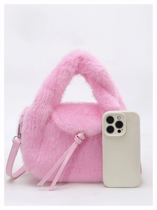 Mini pink faux fur handbag size comparison with smartphone showing compact dimensions