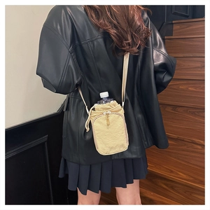 Lightweight crossbody water bottle bag with drawstring closure and front zipper pocket