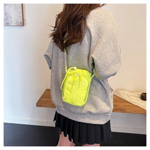 Neon green nylon crossbody bag with drawstring for running and outdoor sports