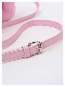 Detailed shot of pink faux leather adjustable shoulder strap with silver metal buckle