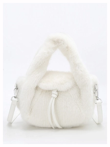 Detailed macro of white faux fur handbag texture with leather drawstring and silver hardware