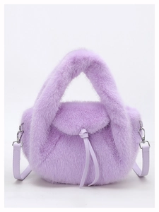 Detail of purple faux fur handbag featuring top handle and knotted leather strap