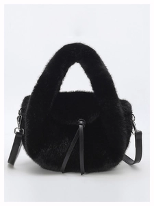 Detail view of black faux fur handbag with leather drawstrings and silver hardware