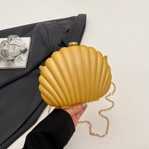 Fashionable shell-shaped yellow acrylic clutch bag with gold chain strap for women