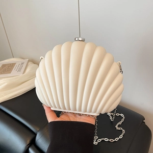 Elegant off-white shell-shaped acrylic clutch bag with silver chain strap for women