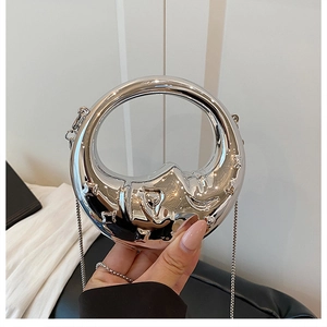 Silver metallic crescent evening bag with artistic wavy texture and elegant chain strap