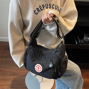 Versatile black washed nylon crossbody bag with adjustable wide sports logo shoulder strap