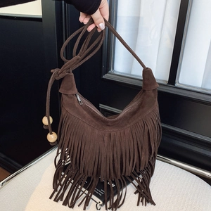 Brown suede half-moon tassel shoulder bag with decorative wooden beads and fringe accents