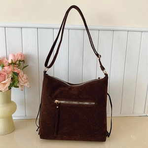 Vintage dark brown suede fringe tote bag with golden hardware and adjustable shoulder strap