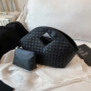 Fashionable black woven tote bag with a semi-circle design and matching inner pouch