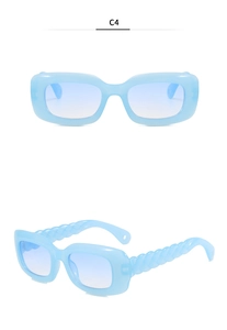 Detail view of light blue rectangle sunglasses featuring unique twisted woven temples in C4