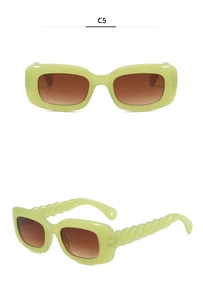 Detail view of lime green sunglasses with unique twisted woven texture on the temples