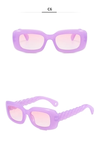 Detail of purple thick frame sunglasses with twisted texture temples and gradient lenses