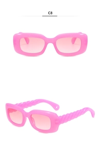 Close-up of pink rectangular sunglasses with unique twisted braid texture on the temple
