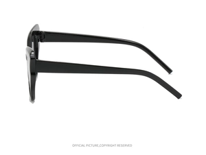 Side view of black thick-frame cat-eye sunglasses with flat temples and sturdy hinges