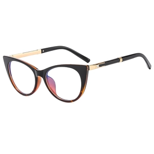 Retro cat-eye eyeglasses with black and tortoiseshell frames and gold metal temples