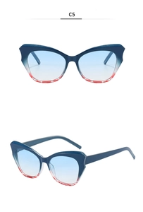 Close-up of blue and red gradient cat-eye sunglasses with tortoiseshell frame details