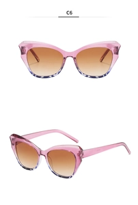 Detail of pink cat-eye sunglasses with purple leopard print and brown gradient lenses