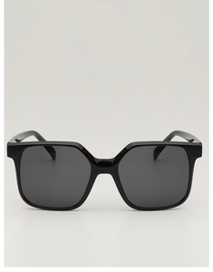 Detail shot of classic black oversized square sunglasses with thick frames and dark lenses