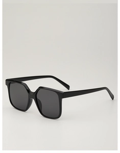 Close-up of classic black oversized square sunglasses with high-gloss finish and dark lenses