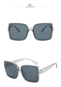 Detail view of white square sunglasses featuring quilted patterns on the temples