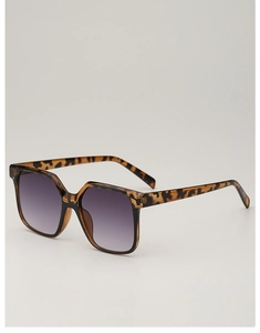 Detail of tortoise shell square frames with grey gradient lenses in a side view