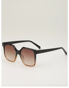 Detail view of square black sunglasses with brown gradient lenses at a 45-degree angle