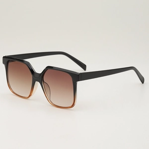 Retro square oversized sunglasses with brown gradient lenses and black to amber frame