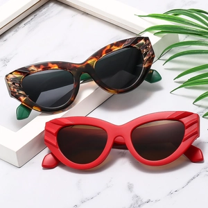 Retro cat-eye sunglasses in tortoiseshell and matte red with embossed temples and PC frame