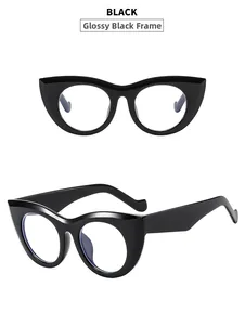 Detail view of glossy black cat eye frame glasses with anti-blue light clear lenses