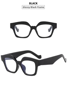 Front and 45-degree side view of shiny black cat-eye sunglasses with wavy frame edges