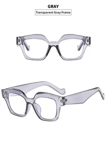 Detail view of transparent gray square frame sunglasses with a modern cat eye design