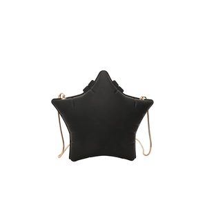 Detail of star-shaped quilted crossbody bag with gold chain strap in black finish